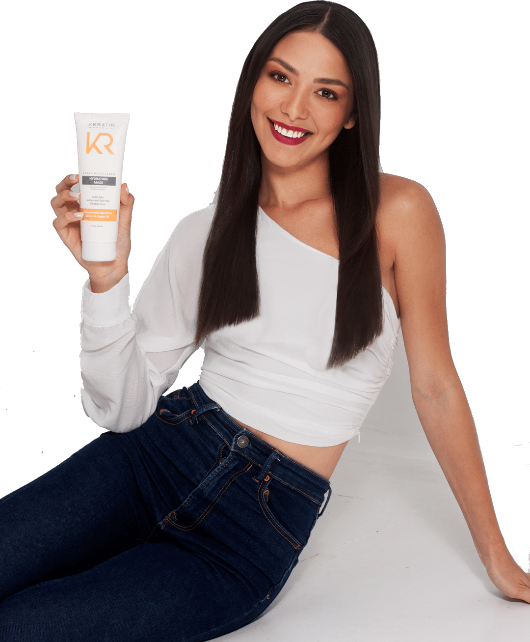 Model with smooth, shiny hair holding a Keratin Republic hydrating mask